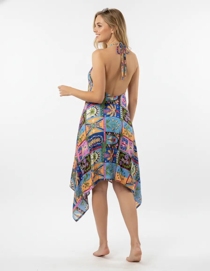 Woman wearing a colorful patchwork dress on a white background